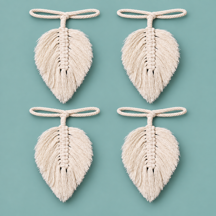 Four combed macrame leaf curtain tie backs on cord loops against teal